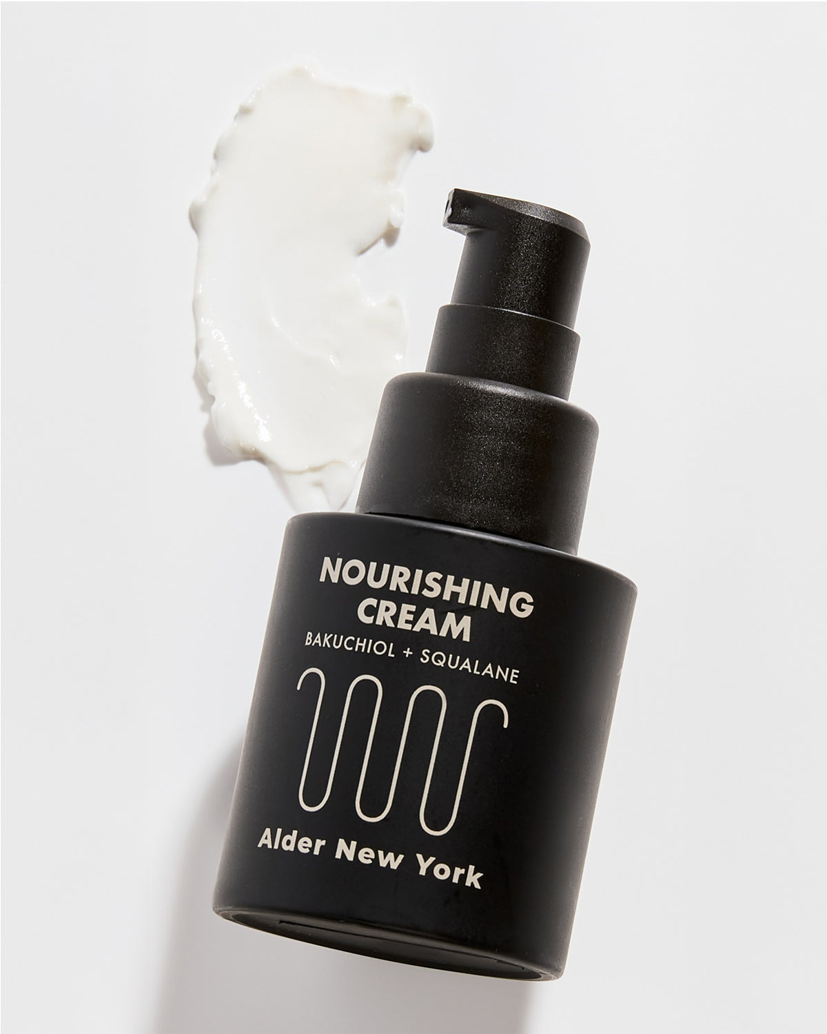 A bottle of Alder New York Nourishing Cream with a swipe of the cream